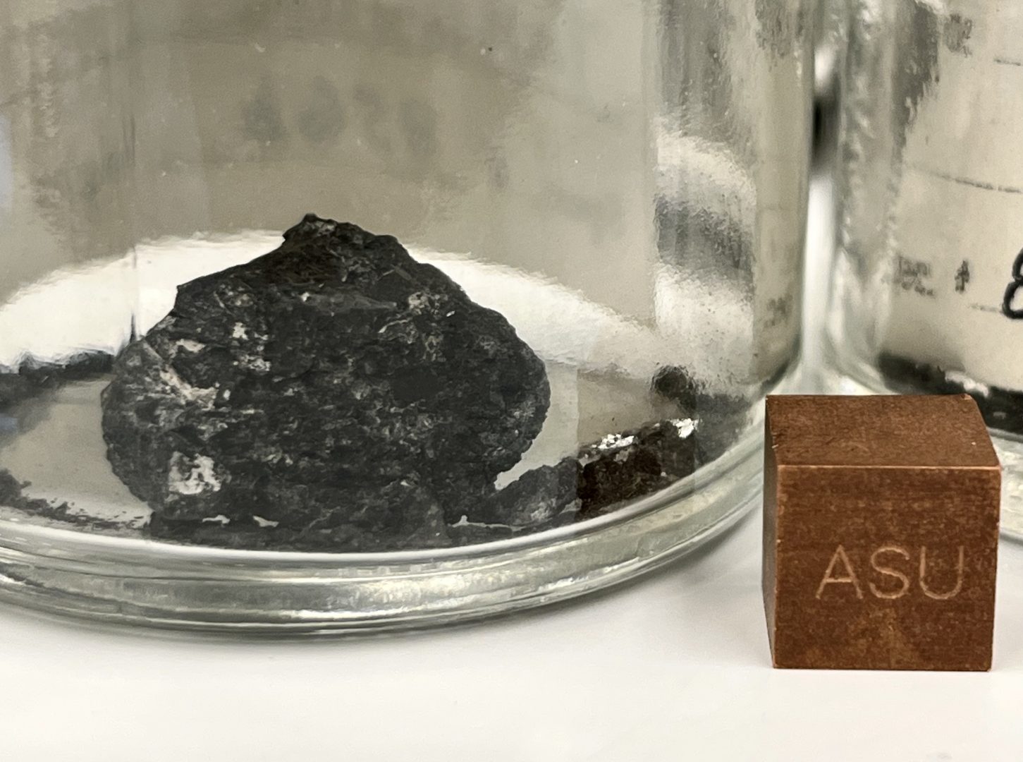 Ivuna meteorite in glass curation jar.