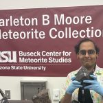 New student Havi Tripathi in the Meteorite Vault holding Allende